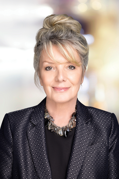 Portrait of Noralyn Heisig, Front Desk Processor.